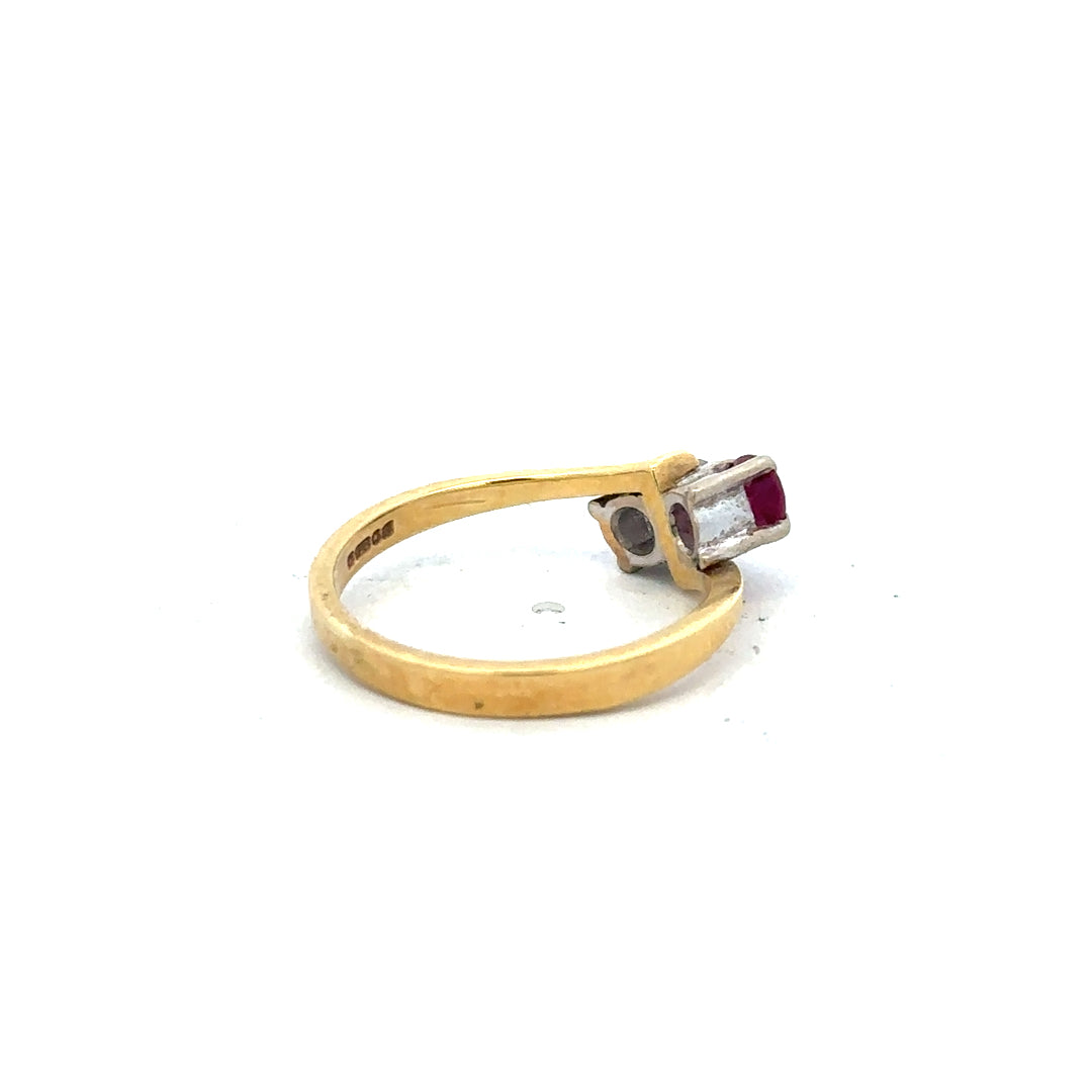 18ct yellow gold ruby and diamond ring in size L, featuring a central ruby surrounded by diamonds, unbranded jewelry accessory.