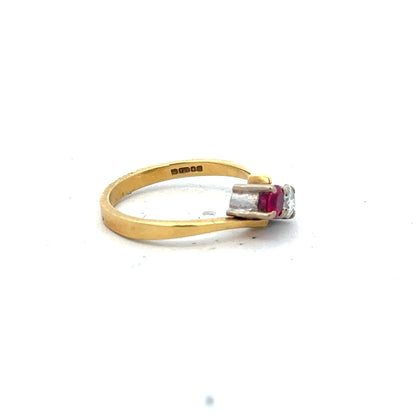 18ct yellow gold ruby and diamond ring in size L, showcasing a vibrant ruby centerpiece with sparkling diamonds.