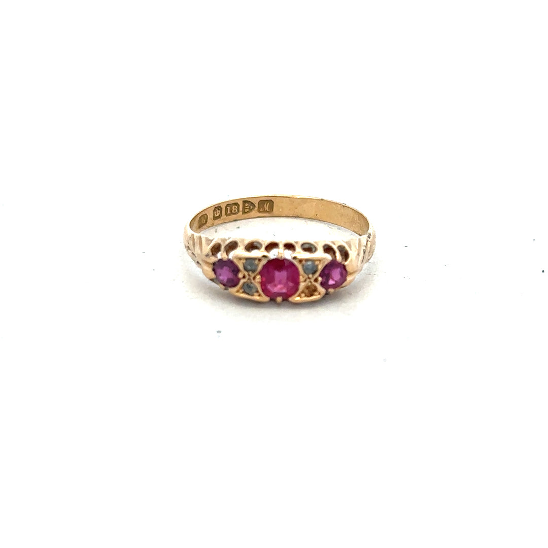 18ct yellow gold ruby and diamond ring, size P, featuring a central ruby surrounded by sparkling diamonds.