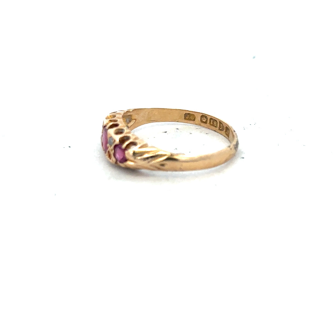 18ct yellow gold ruby and diamond ring, size P, featuring a central ruby gemstone with surrounding diamonds.