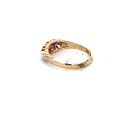 18ct yellow gold ruby and diamond ring with a size P, featuring a central ruby and sparkling diamonds.
