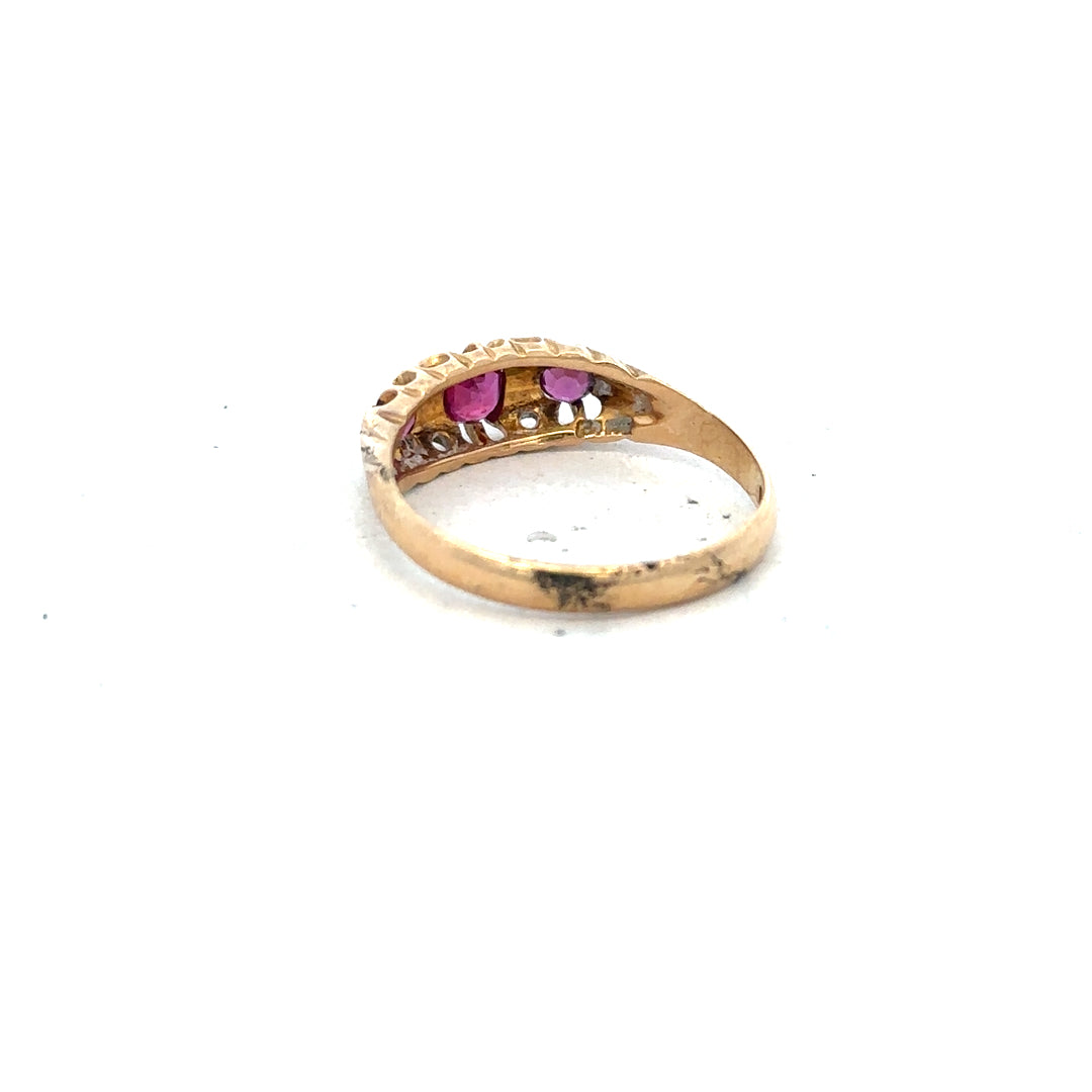 18ct yellow gold ruby and diamond ring in size P with detailed gemstone setting and elegant band design.