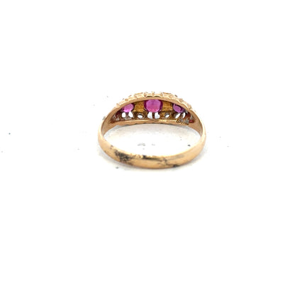 18ct yellow gold ruby and diamond ring in size P, featuring a central ruby with diamond accents, unbranded jewelry accessory.