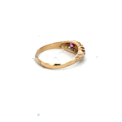 18ct yellow gold ruby and diamond ring with a central ruby and surrounding diamonds, size P, unbranded jewelry piece.