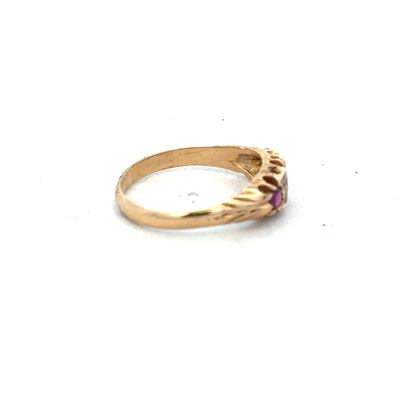 18ct yellow gold ruby and diamond ring in size P, featuring a central ruby with surrounding diamonds, unbranded jewelry accessory.