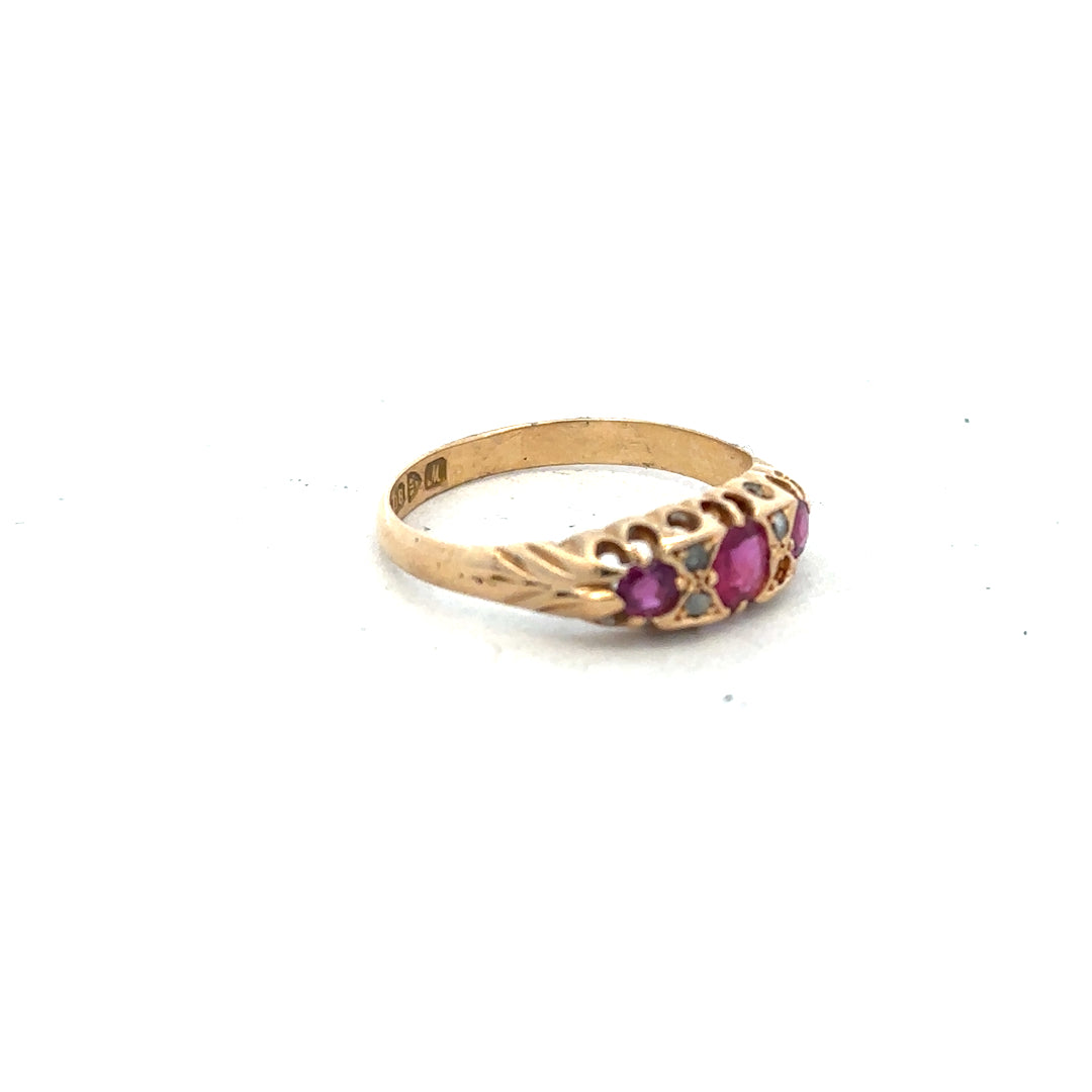 18ct yellow gold ruby and diamond ring in size P, featuring a vibrant ruby center and sparkling diamonds.