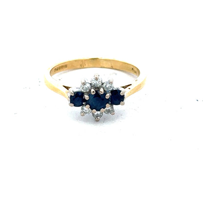 18ct yellow gold sapphire and diamond ring, size K, featuring a sparkling gemstone and elegant design.