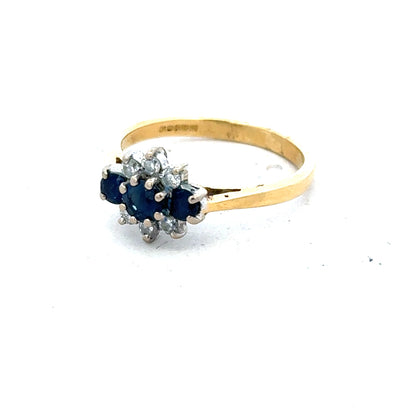 18ct yellow gold sapphire and diamond ring in size K, featuring a detailed close-up of the elegant jewelry design.