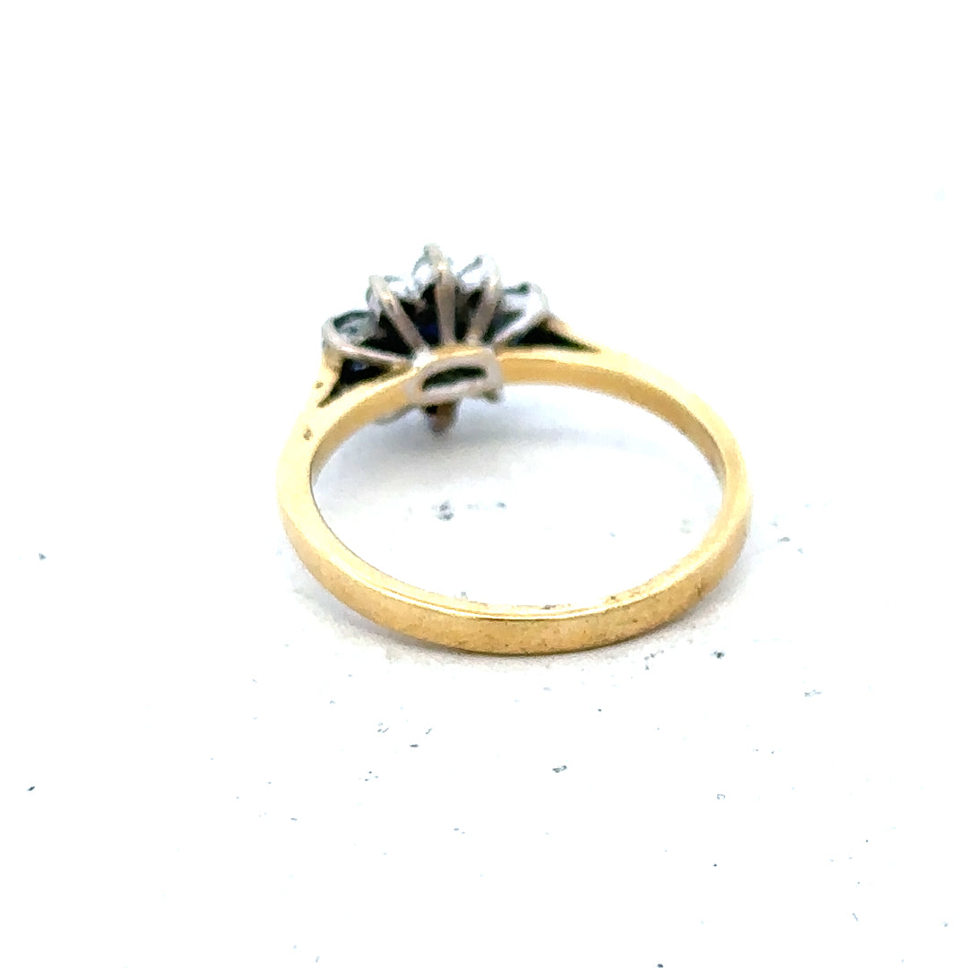 18ct yellow gold sapphire and diamond ring, size K, featuring a vibrant blue sapphire center with sparkling diamonds.