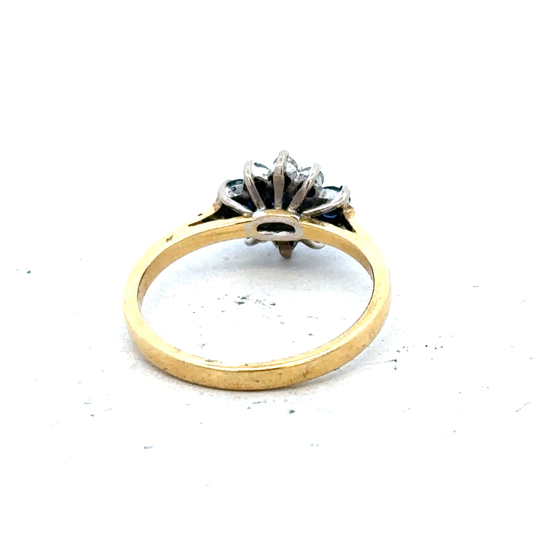 18ct yellow gold sapphire and diamond ring, size K, featuring a central sapphire with diamond accents, elegant jewelry piece.