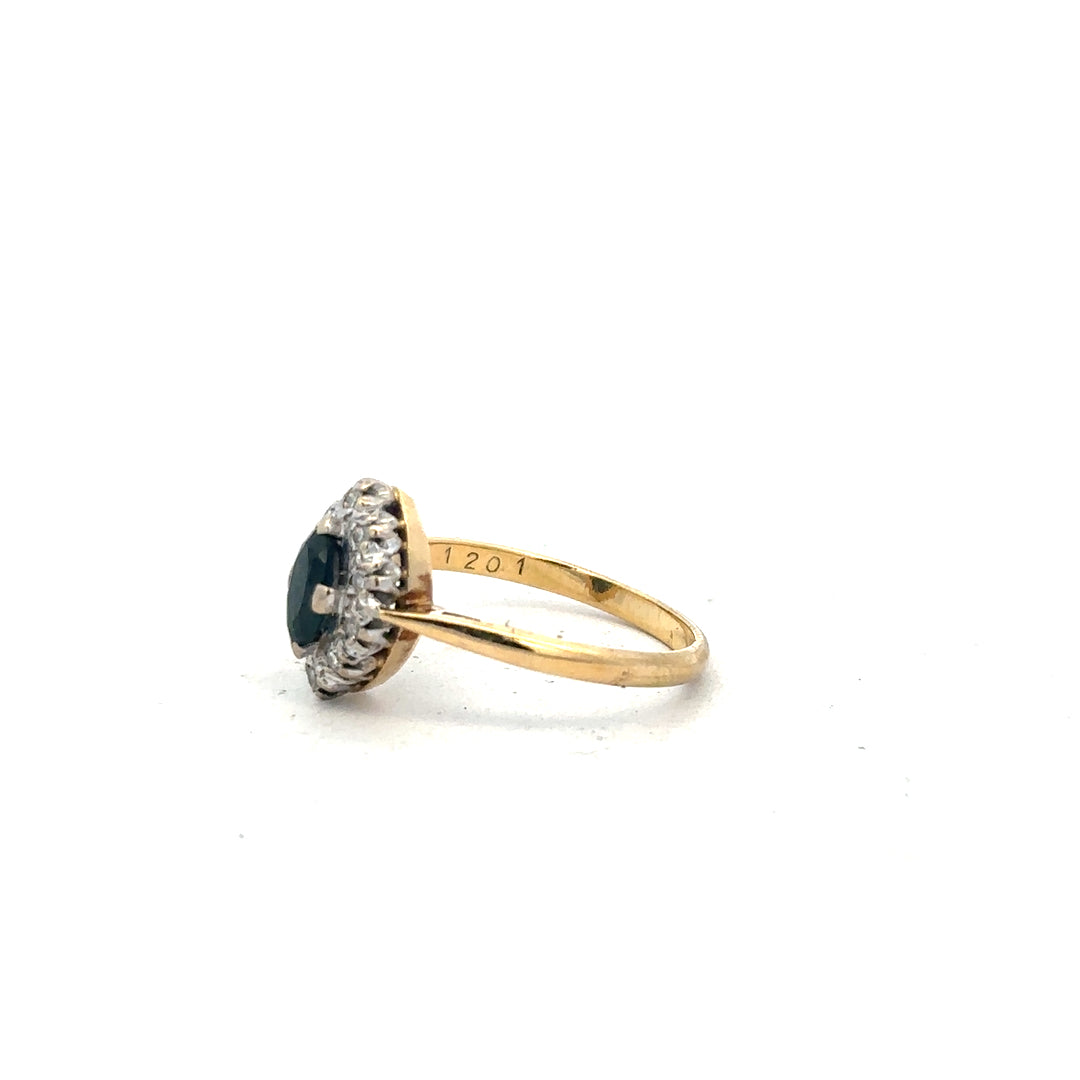 18ct yellow gold sapphire and diamond ring, size M, featuring a central sapphire with diamond accents, elegant jewelry piece.
