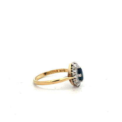 18ct yellow gold sapphire and diamond ring, size M, featuring a vibrant sapphire centerpiece with sparkling diamonds.