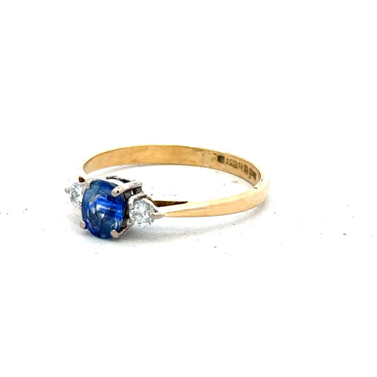 18ct yellow gold sapphire and diamond ring in size M, featuring a central sapphire gemstone with diamond accents.