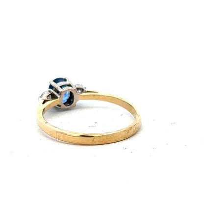 18ct yellow gold sapphire and diamond ring, size M, featuring a central sapphire with diamond accents, unbranded jewelry.