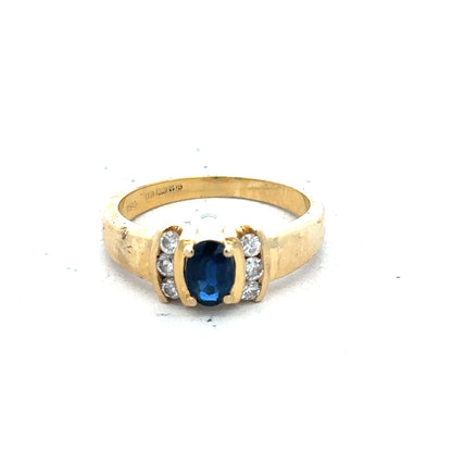 18ct yellow gold sapphire and diamond ring in size M, showcasing a sparkling blue sapphire center with diamond accents.