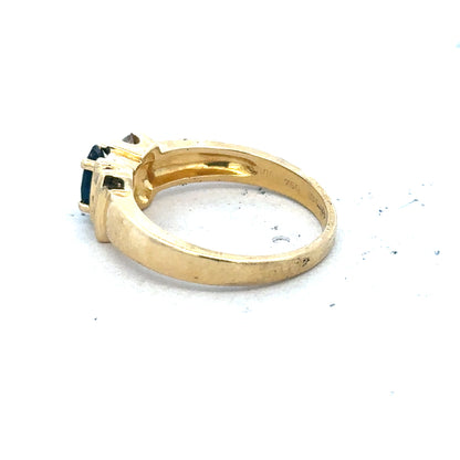 18ct yellow gold sapphire and diamond ring, size M, featuring a central sapphire gemstone with surrounding diamonds.