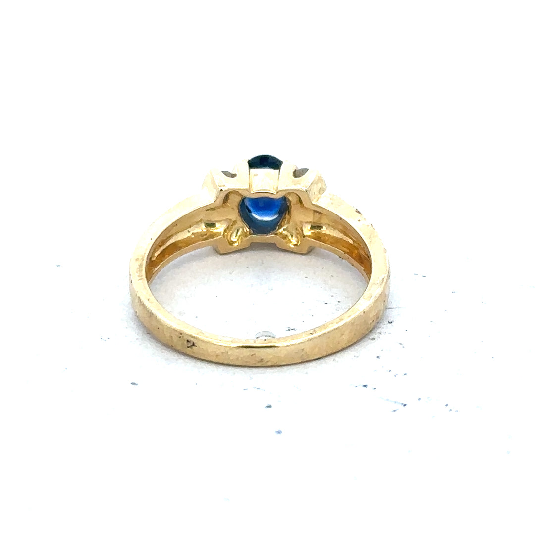 18ct yellow gold sapphire and diamond ring in size M, featuring a central sapphire gemstone and sparkling diamonds.
