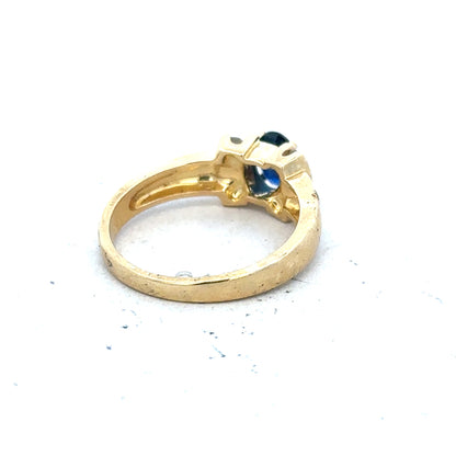 18ct yellow gold sapphire and diamond ring in size M, featuring a central sapphire surrounded by sparkling diamonds.