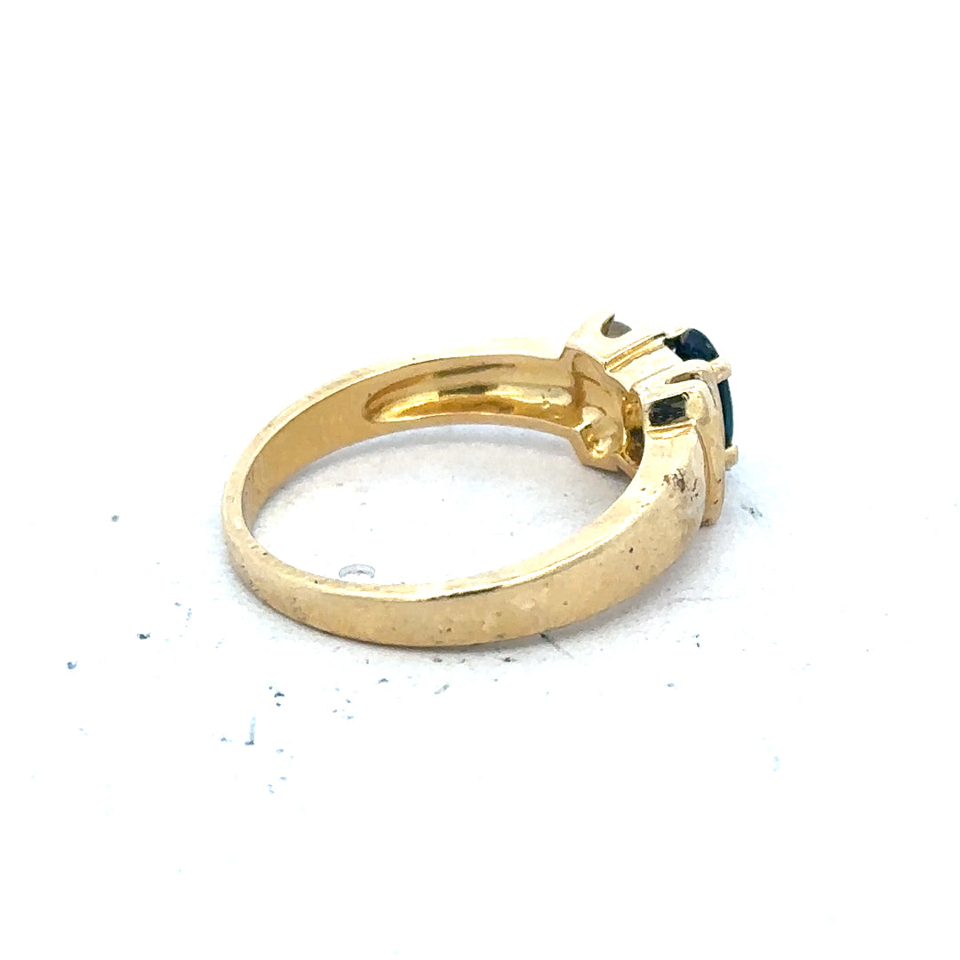 18ct yellow gold sapphire and diamond ring in size M, featuring a central blue sapphire with diamond accents.