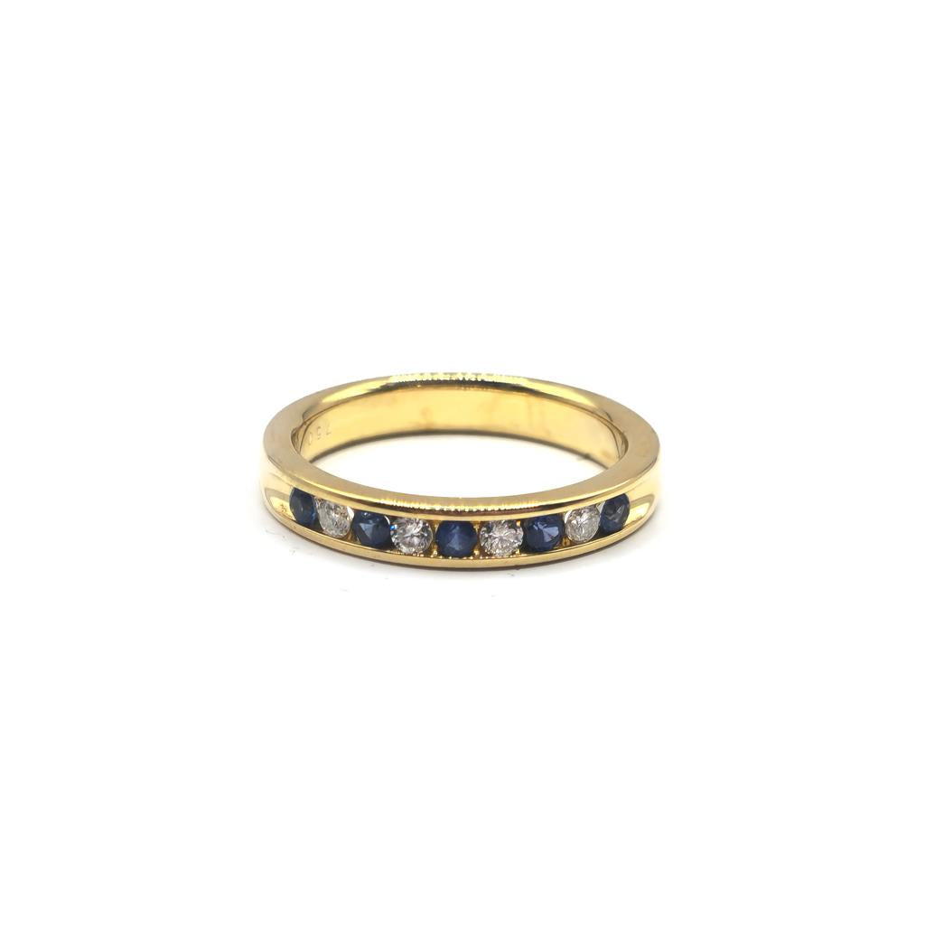 18ct yellow gold sapphire and diamond ring, size N, featuring a central sapphire and diamond accents in a luxurious jewelry design.