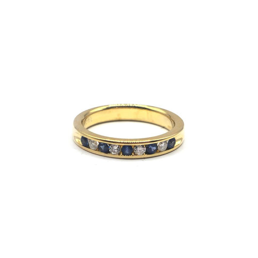 18ct yellow gold sapphire and diamond ring, size N, featuring a central sapphire and diamond accents in a luxurious jewelry design.