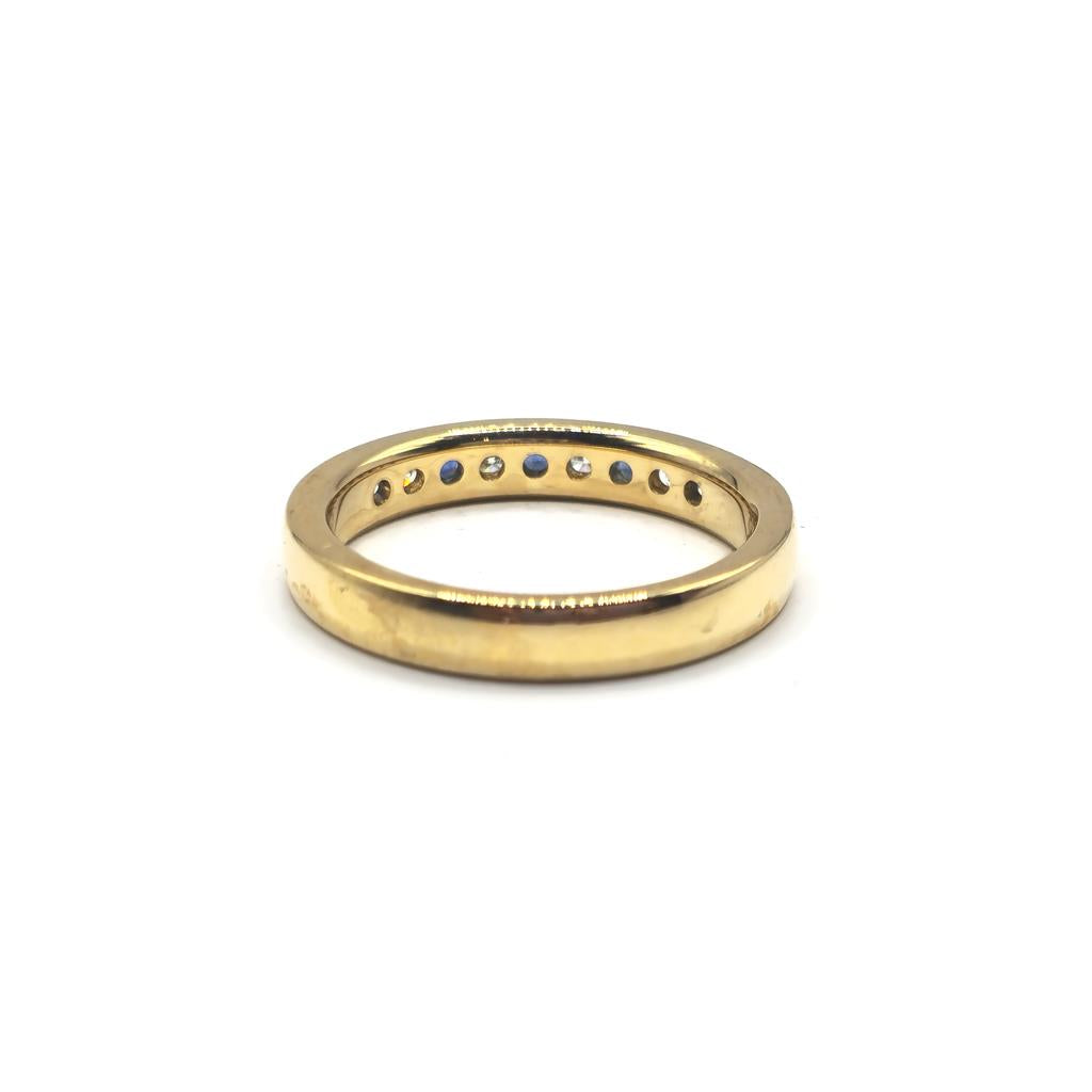 18ct yellow gold sapphire and diamond ring in size N, featuring a central sapphire gemstone with surrounding diamonds.