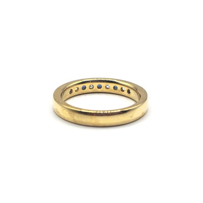 18ct yellow gold sapphire and diamond ring in size N, featuring a central sapphire gemstone with surrounding diamonds.