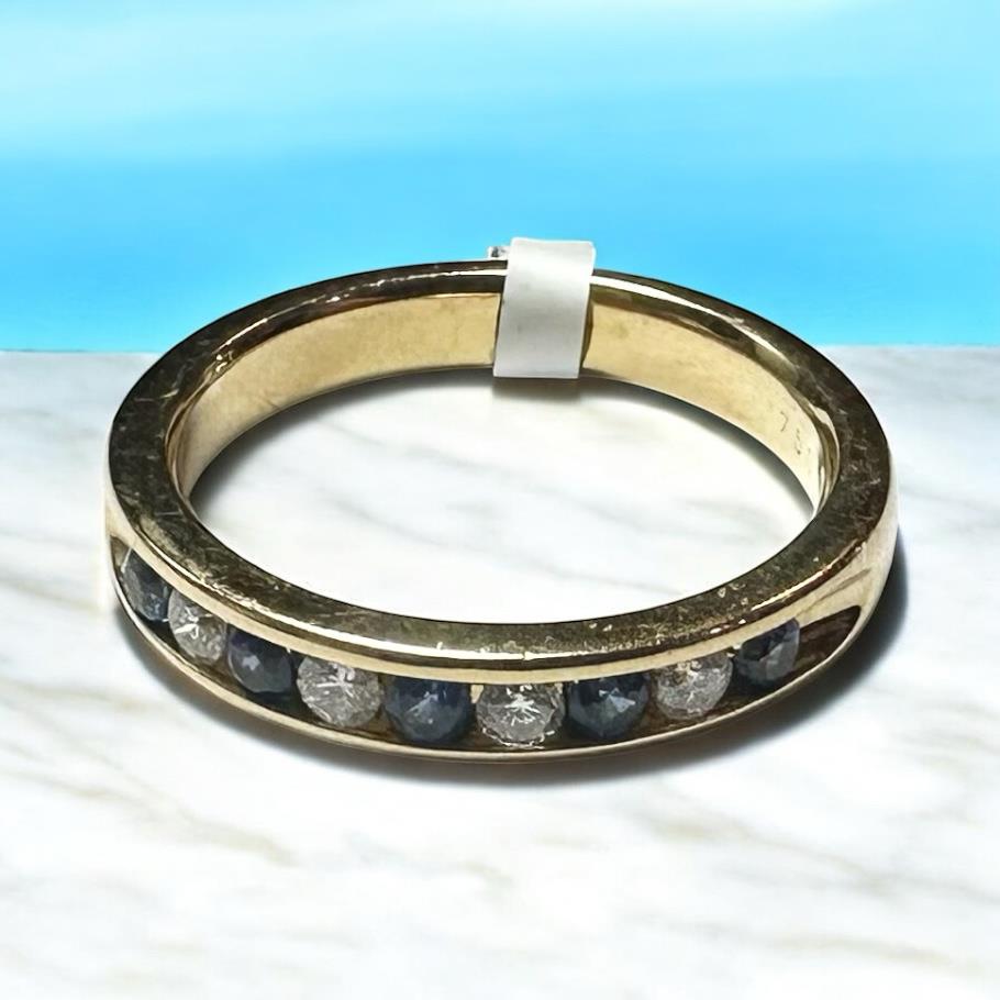 18ct yellow gold sapphire and diamond ring, size N, featuring a central sapphire with diamond accents.