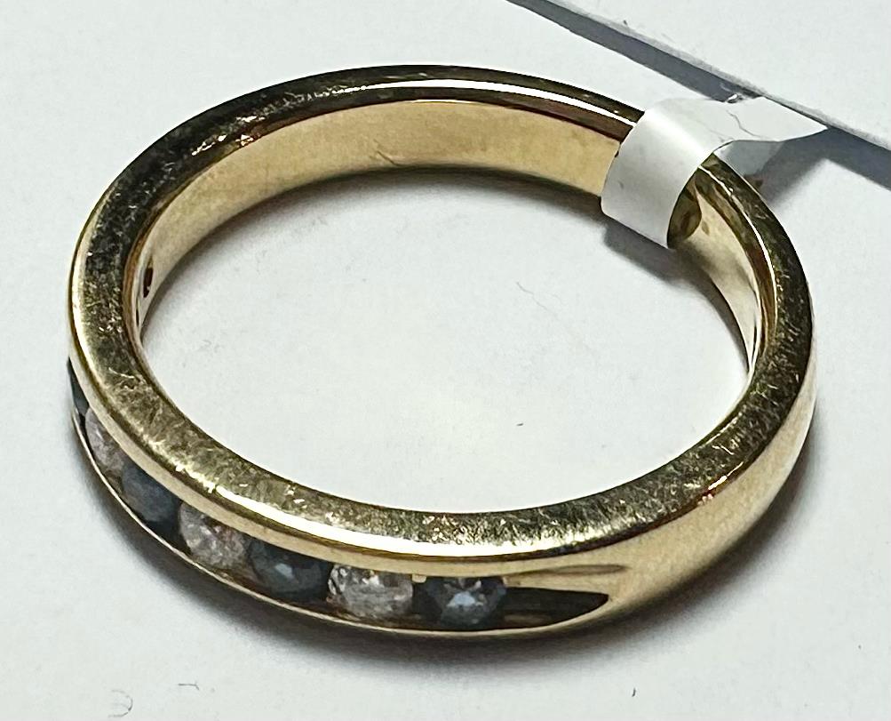 18ct yellow gold sapphire and diamond ring in size N, featuring a central sapphire with diamond accents, unbranded jewelry piece.