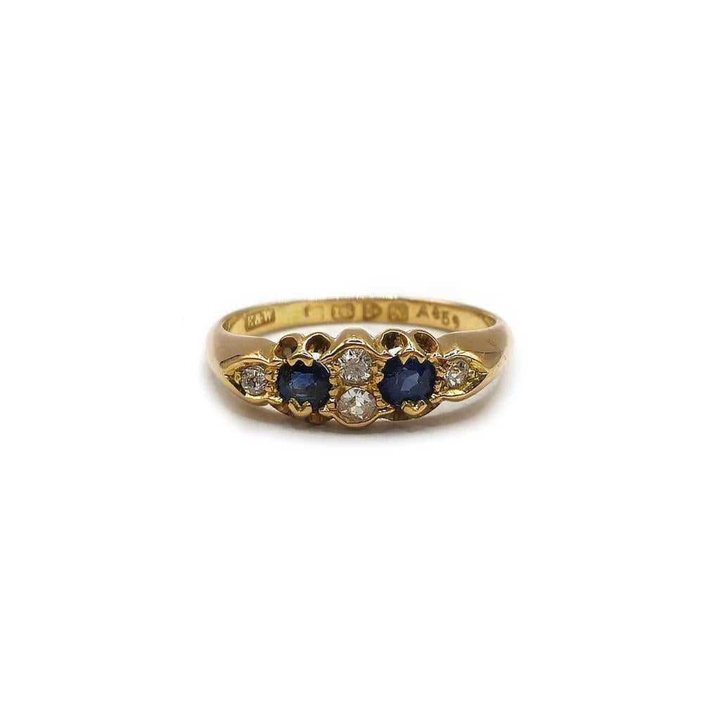 Unbranded 18ct yellow gold sapphire and diamond ring, size N1/2, featuring a detailed gemstone design.