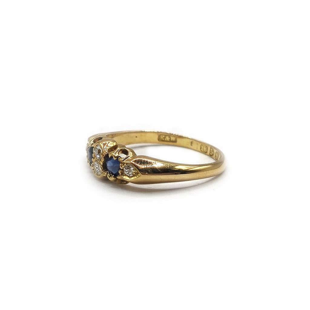 Unbranded 18ct yellow gold sapphire and diamond ring, size N1/2, featuring a central sapphire gemstone and sparkling diamonds.