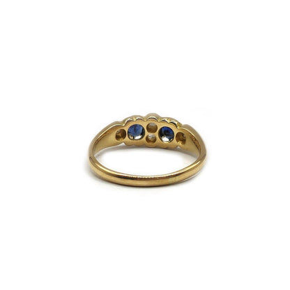 Unbranded 18ct yellow gold sapphire and diamond ring, size N 1/2, featuring a sparkling sapphire centerpiece and diamond accents.