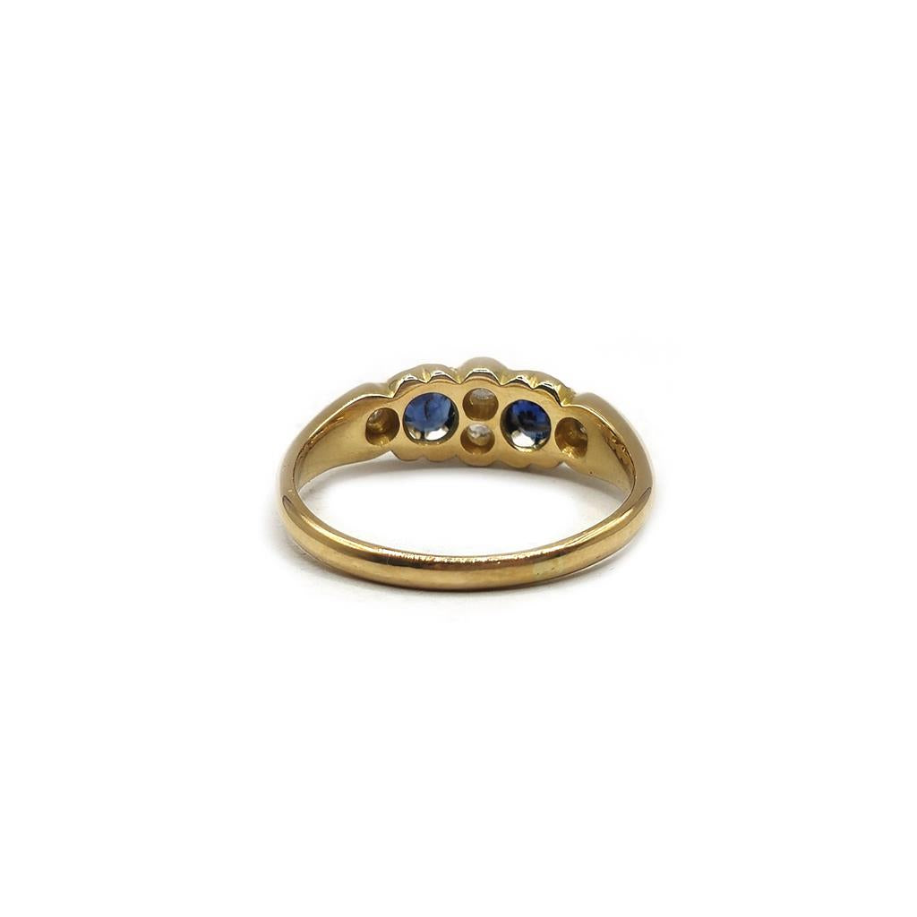 Unbranded 18ct yellow gold sapphire and diamond ring, size N1/2, featuring a detailed design with sparkling gemstones.