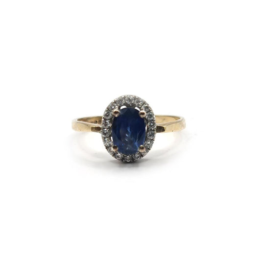 18ct yellow gold sapphire and diamond ring with a central blue sapphire and sparkling diamonds, elegant jewelry piece.