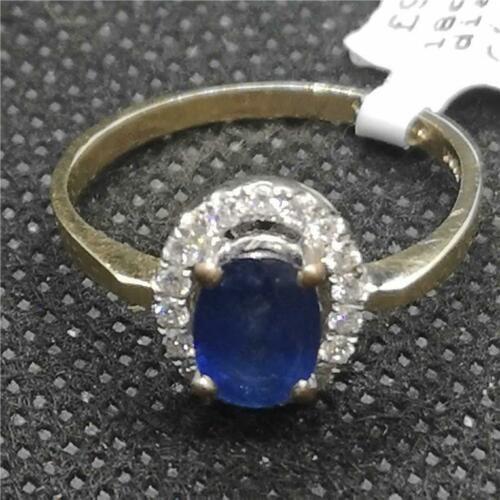 18ct yellow gold ring with a central sapphire gemstone and diamond accents, elegant jewelry piece.