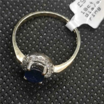 18ct yellow gold sapphire and diamond ring, featuring a central sapphire gemstone surrounded by sparkling diamonds.
