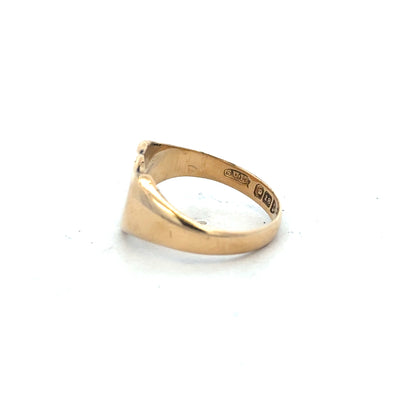 18ct yellow gold signet ring in size O, unbranded, with a smooth polished surface and classic design.