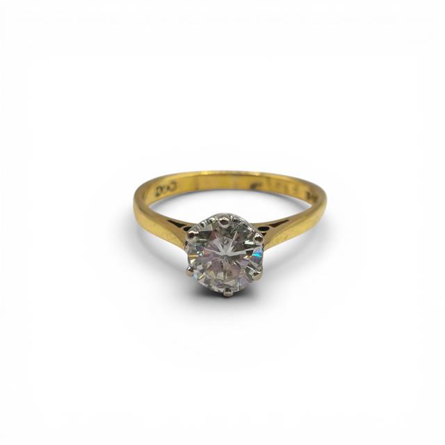 18ct yellow gold single diamond ring featuring a sparkling diamond, designed for elegance and timeless style.
