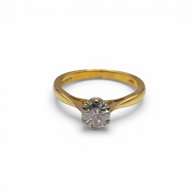 18ct yellow gold diamond ring featuring a single sparkling diamond stone, elegant and classic jewelry piece.