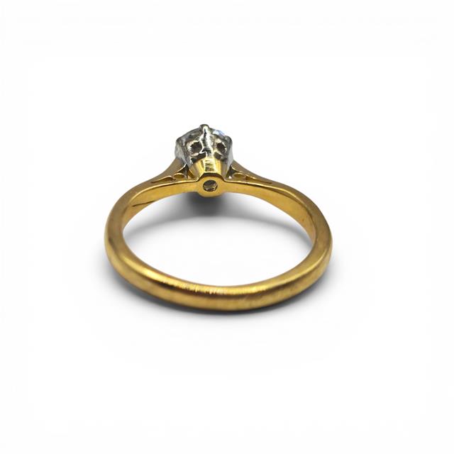 18ct yellow gold diamond ring with a single sparkling stone, elegant jewelry piece with a sleek design and classic style.