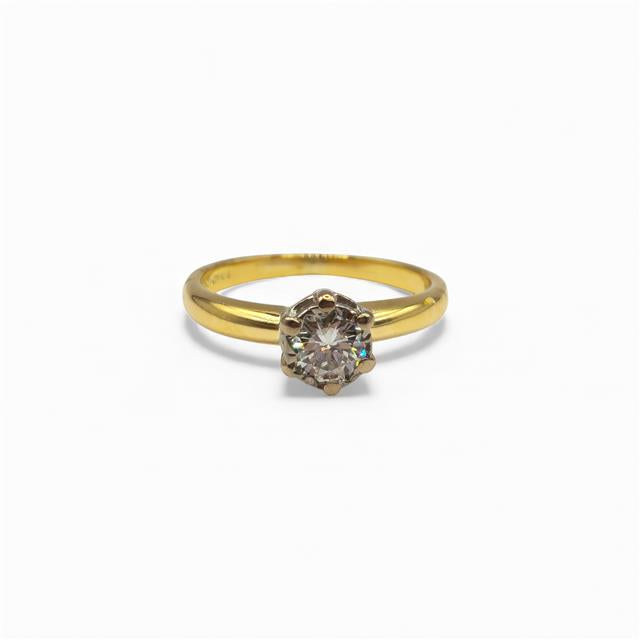 18ct yellow gold diamond ring with a single sparkling stone, showcasing elegant craftsmanship and a classic design.