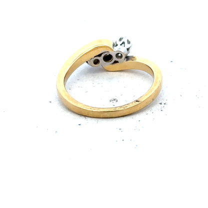 18ct yellow gold three diamond ring with a simple band, showcasing elegant three-stone design and sparkling diamonds.
