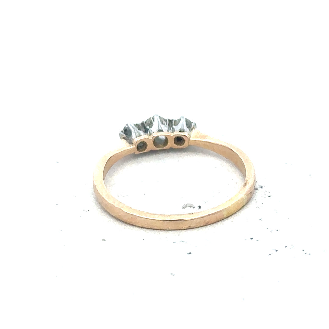 18ct yellow gold three diamond ring with a sleek band, showcasing elegant sparkle and craftsmanship.
