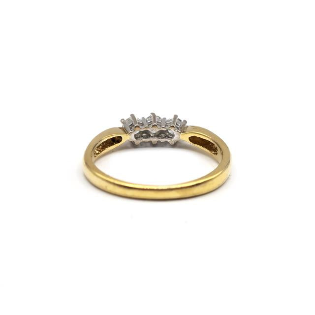 18ct yellow gold ring with three diamonds, featuring a sleek and elegant design, unbranded jewelry piece.