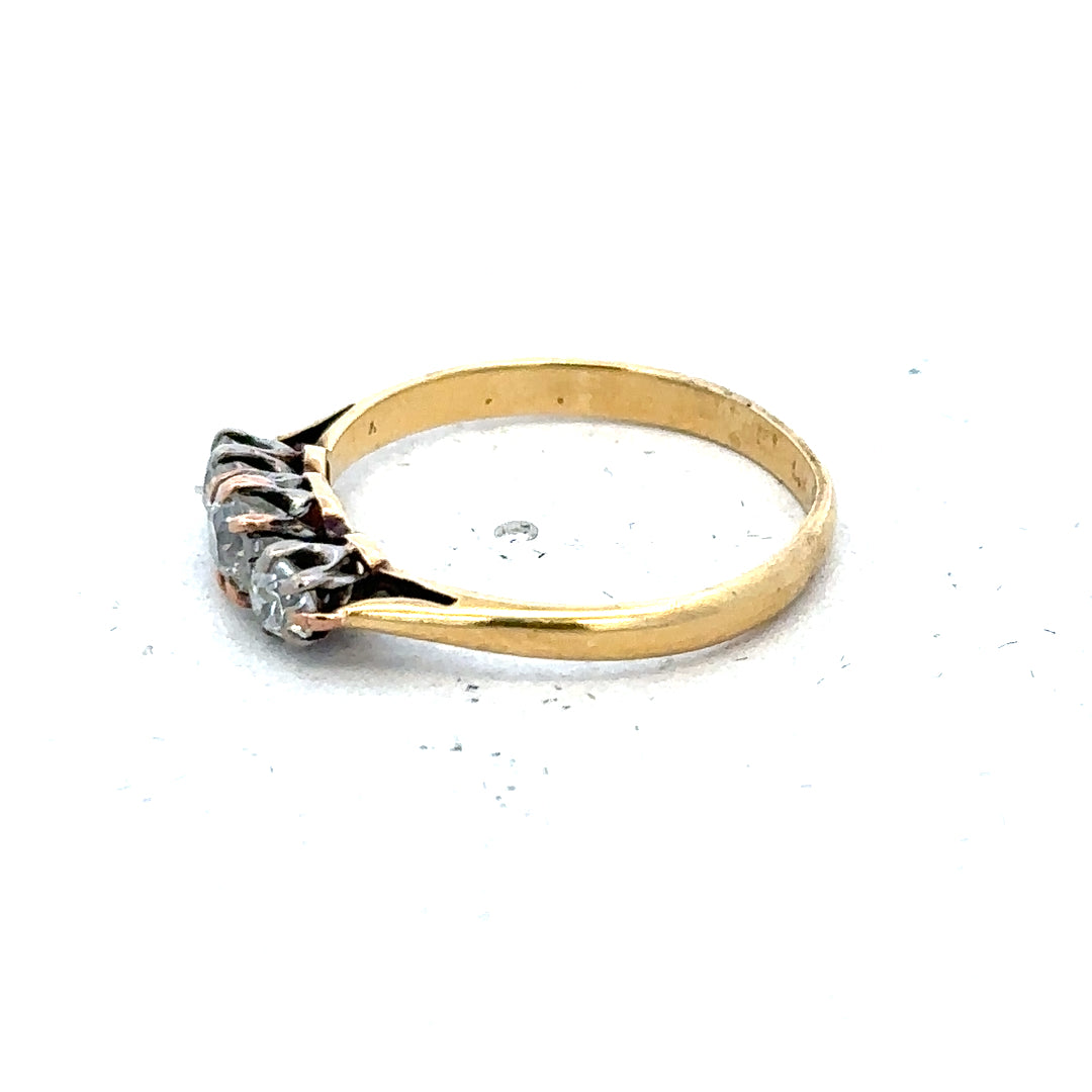 18ct yellow gold three diamond ring in size L, featuring elegant design and sparkling gemstones.