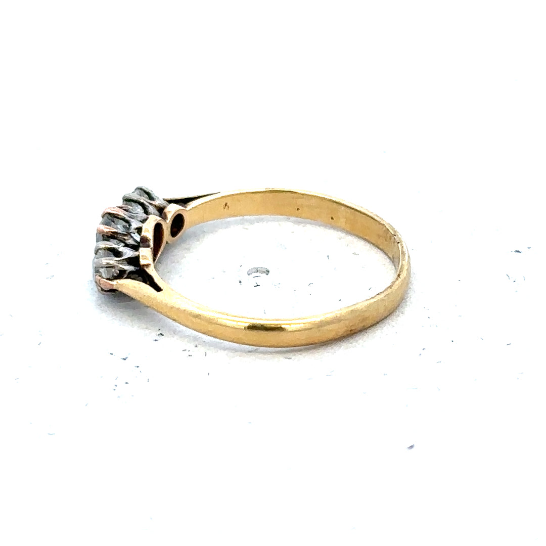 18ct yellow gold three diamond ring in size L with a simple, elegant design, featuring sparkling diamonds on a classic band.