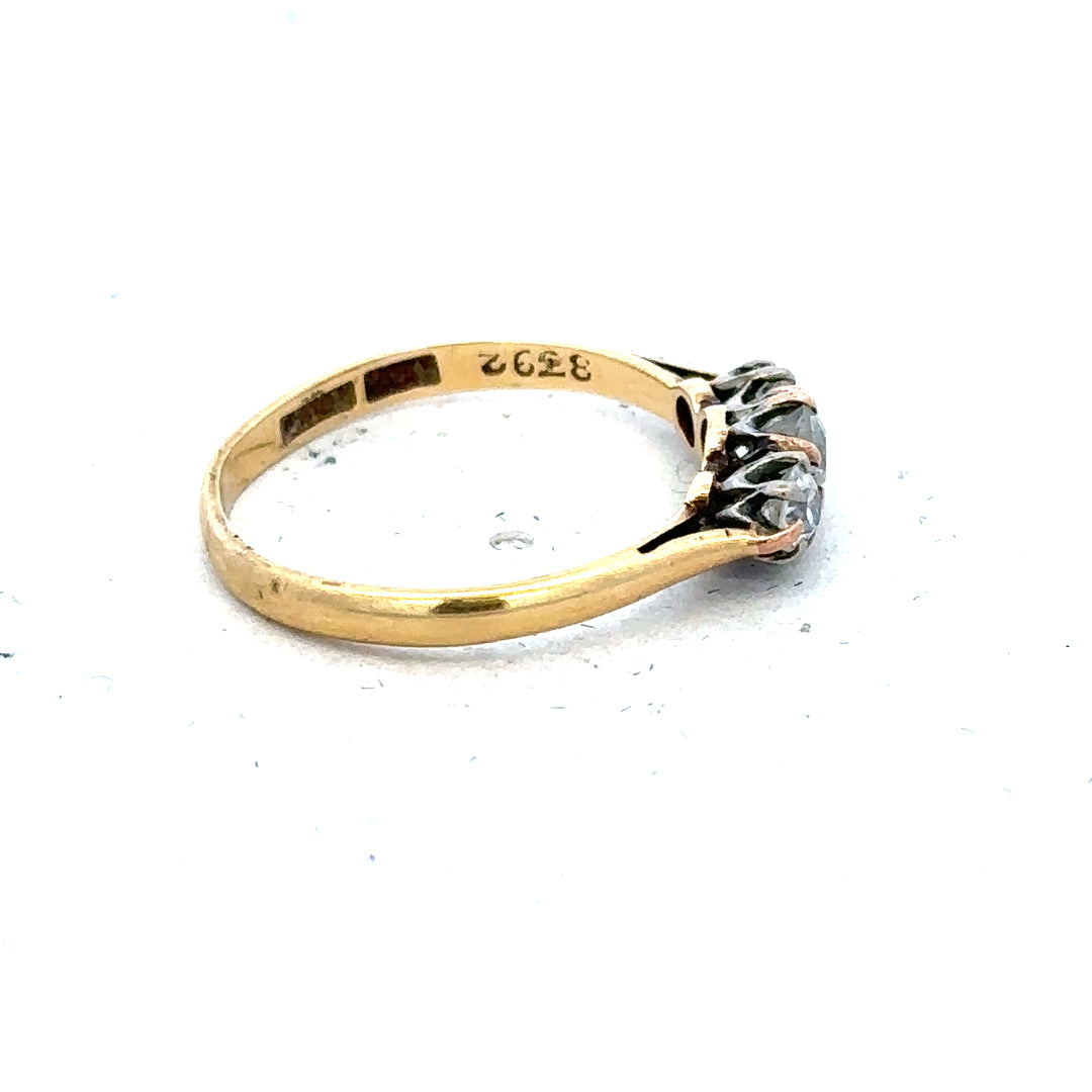 18ct yellow gold three diamond ring in size L, showcasing elegant jewelry craftsmanship and sparkling gemstone accents.