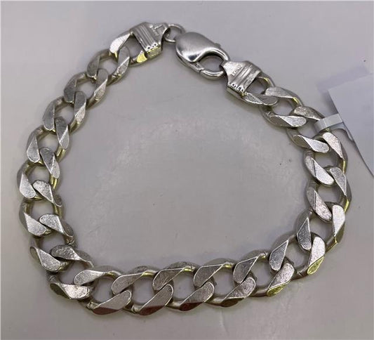 Sterling silver bracelet featuring intricate design, unbranded, showcasing a polished, elegant jewelry piece with detailed craftsmanship.