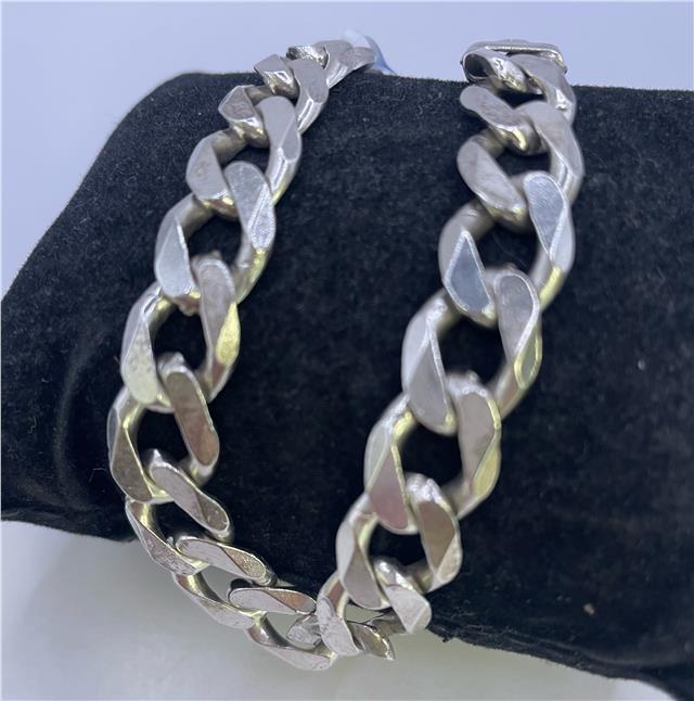 925 silver bracelet with intricate link design, unbranded jewelry accessory, showcasing polished silver finish and craftsmanship.