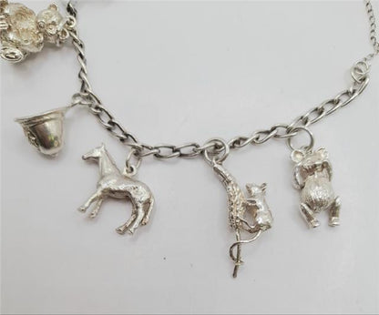 925 silver charm bracelet with intricate details, unbranded, weighing 27.3g, showcasing a stylish and elegant jewelry accessory.
